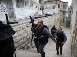 Israeli police officers patrol near a house purchased by Jews in the mostly Arab neighbourhood of Silwan, East Jerusalem